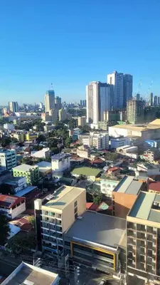 a view of a city with tall buildings at Richard's Pad in Manila