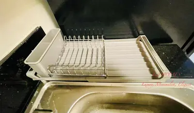 a toaster oven with a drying rack on top of a sink at EJ Homes - Shore 3 Residences in Manila