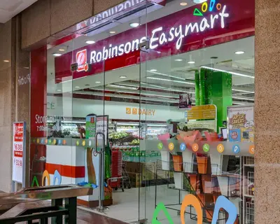 a store with a glass window in a mall at Vintage Mickey Disney Stay in BGC -200mbps wifi in Manila