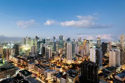 a view of a city at night at Italian Style Unit in Venice Luxury Residences in Manila