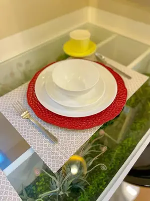 a plate sitting on a table with a red napkin at Deryll's Fun house in Manila