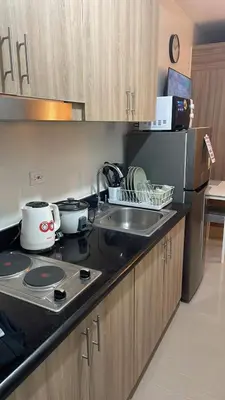 a kitchen with a sink and a counter top at Tower 3 Shore 2 High Floor 1BR Good 4PAX in Manila