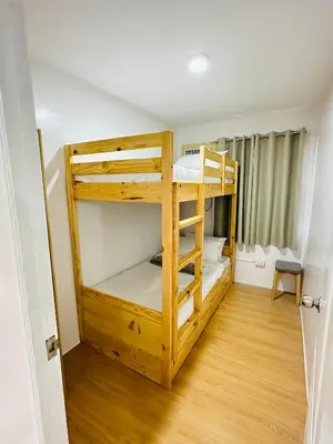 a bedroom with two bunk beds in a room at Tiffany's Place in Imus