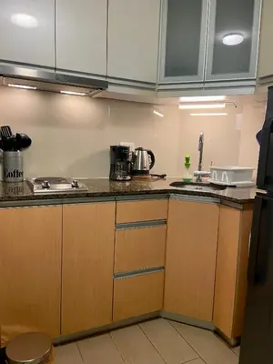 a kitchen with a sink and a counter top at Beautiful Studio Near Resorts World NAIA T3 in Manila