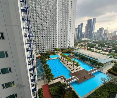 an aerial view of a large building with a swimming pool at P3K Jazz Staycation in Manila