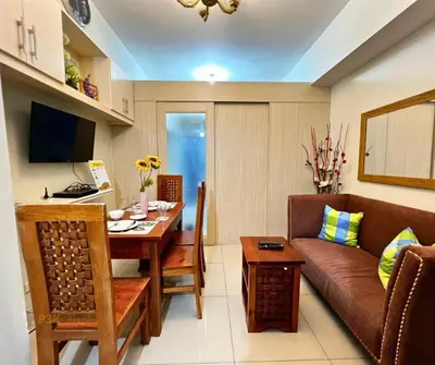 a living room with a couch and a table at P3K Jazz Staycation in Manila