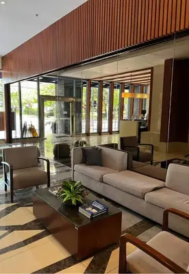 a living room with two couches and a coffee table at Newly Renovated 2-storey Loft at Greenbelt 1 in Manila