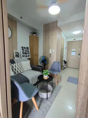a living room with a couch and a table at Casa Florentino in Manila