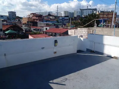 a view of a city from the roof of a building at Taguig Apartment Near ARCA South in Manila
