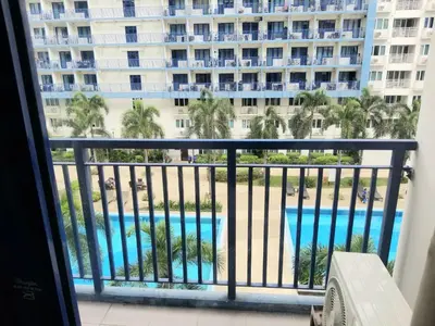 a view of a pool from a hotel balcony at Sea residence Family Group Affordable staycation in Manila