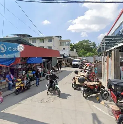 a group of motorcycles parked on the side of a street at Lawton Residences Studio Room 2H in Manila