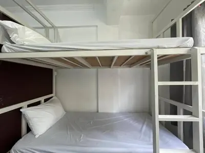 a couple of bunk beds in a room at Lawton Residences Studio Room 3B - 4 pax in Manila