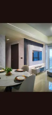 a large living room with a table and chairs at One Winstar Realty Corp in Manila