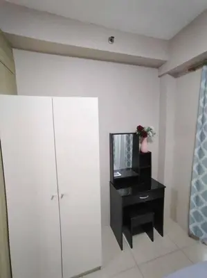 a living room with a tv and a black cabinet at Near MOA at SHORE RESIDENCES 1BR with balcony -unlimited WIFI in Manila