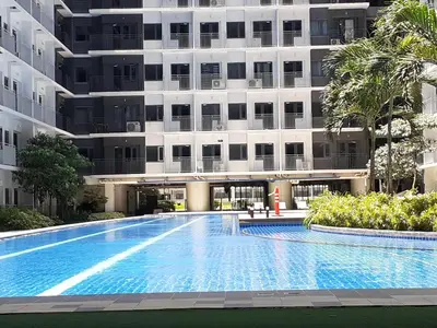 an empty swimming pool in front of a building at Casa Laelia in Manila
