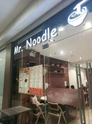 a mcdonalds restaurant with a sign in the window at 1 Bedroom with Balcony Near MOA in Manila
