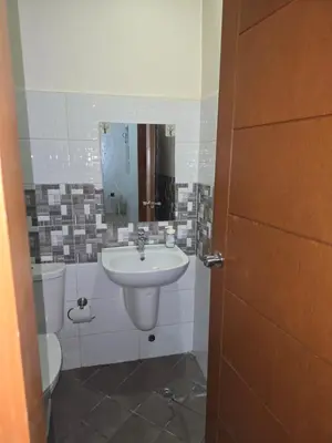 a bathroom with a sink and a toilet at 1 Bedroom Apartment in Central Makati in Manila