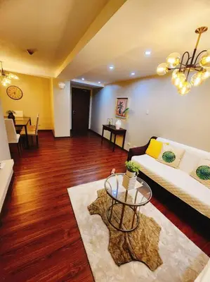 a living room with a couch and a table at 2BR 90sqm Furnished Condo Shaw Blvd, Mandaluyong in Manila