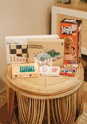 a wicker table with boxes on top of it at Somnus Suites at Air Residences in Manila
