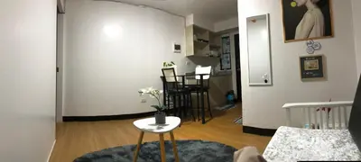 a living room with a table and chairs in a room at Your Home Away From Home in Imus