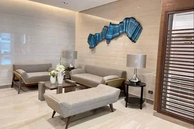 a living room with two couches and a couch at Condo With Water Views in Manila