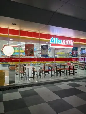 a restaurant with tables and chairs in a store at Condo With Water Views in Manila