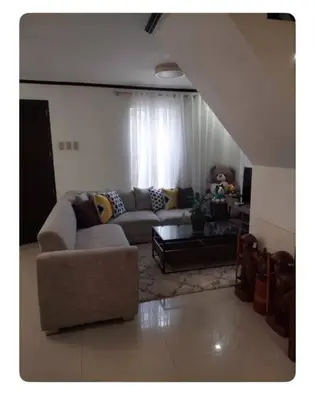 a living room with a couch and a table at Florie's Home in Santa Rosa