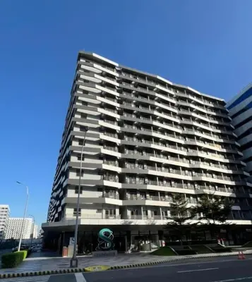 a large apartment building with balconies on a city street at Juliš Apartment S residence- Moa complex pasay in Manila