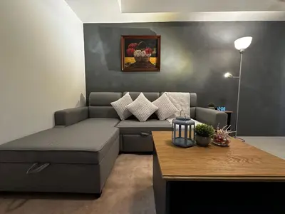 a living room with a couch and a table at 1BR Stay near NAIA Terminal 3 via Runway Manila in Manila