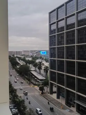 a view of a city street with a tall building at Crib2Go Lupita Suite with City Street View in Manila