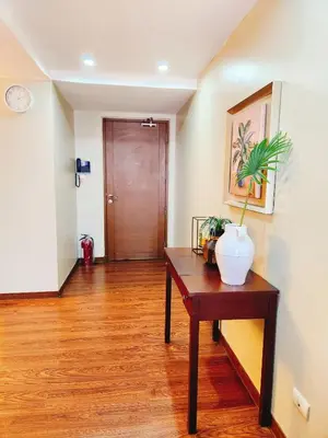 a room with a table with a plant on it at Furnished 2Bedroom 2Bathroom plus Utility Room with 2 Beds in Manila