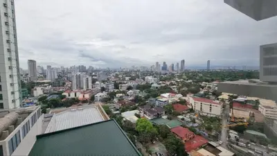 an aerial view of a city with tall buildings at Furnished 2Bedroom 2Bathroom plus Utility Room with 2 Beds in Manila
