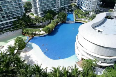 an overhead view of a swimming pool at a resort at Azure Urban Resort by Melrose Avenue in Manila