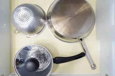 two straining utensils and a pot on a counter at Azure Urban Resort by Melrose Avenue in Manila