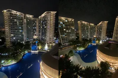 a view of a city at night with tall buildings at Azure Urban Resort by Melrose Avenue in Manila