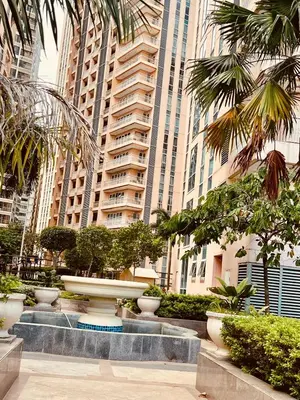 a fountain in the middle of a city with tall buildings at Venetian Haven BGC Venice Grand Canal Apart ment, 4 Bedrooms, for 10 Guests in Manila