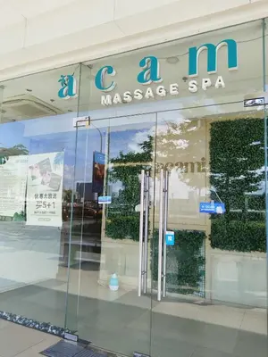 a glass storefront with a massage spa sign on it at Pasay Shore Residences with one bedroom with balcony in Manila