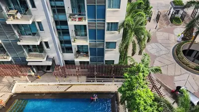 an overhead view of a swimming pool in front of a building at Casa Antonio at 7i Two Palm Tree Villas Beside NAIA3 in Manila