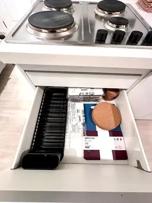 an open drawer in a kitchen with a stove at Azure 2Br 1Ba with City View Balcony and Free Parking in Manila