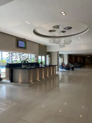 a lobby of a building with a check in counter at Sea Residences MOA Pasay City - Reynil in Manila