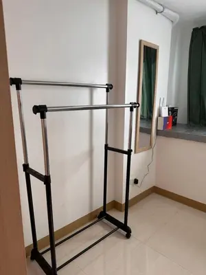 a metal stand in a room with a mirror at RKChillescapes in Manila