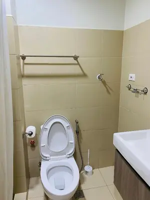 a bathroom with a toilet and a sink at SMDC Shore 3 Residences in Manila