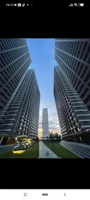 two tall buildings standing next to each other at Reden Staycation in Manila