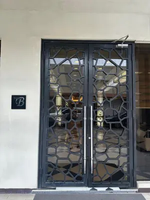 a door to a store with a rack of masks at Faerydae Suites - Free Pool Access in Manila
