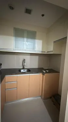 a kitchen with a sink and a counter top at Cluster 6 3D 81 Newport Boulevard in Manila