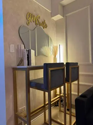 a dressing table with two chairs and a mirror at GM Suite near SM MOA, Pasay I 2 Beds I City & Bay View in Manila