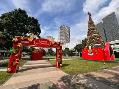a christmas tree in a park in a city at Condo Ortigas CBD in Manila