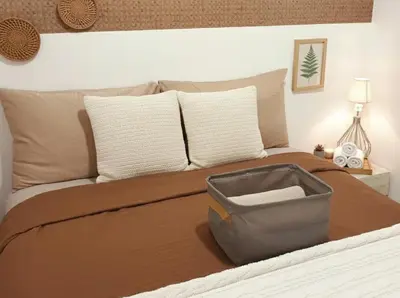 a bedroom with a bed with a suitcase on it at SMDC Apartment Ortigas in Manila