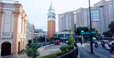 a city street with a clock tower and buildings at Perfect Location BGC - Mckinley in Manila