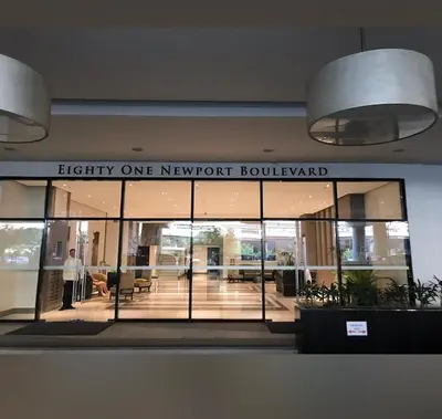 a building with a sign that reads fidelity one newportroulevard at 81 Newport Blvd Cluster 5 Unit 4E by Rechelle Nunag in Manila